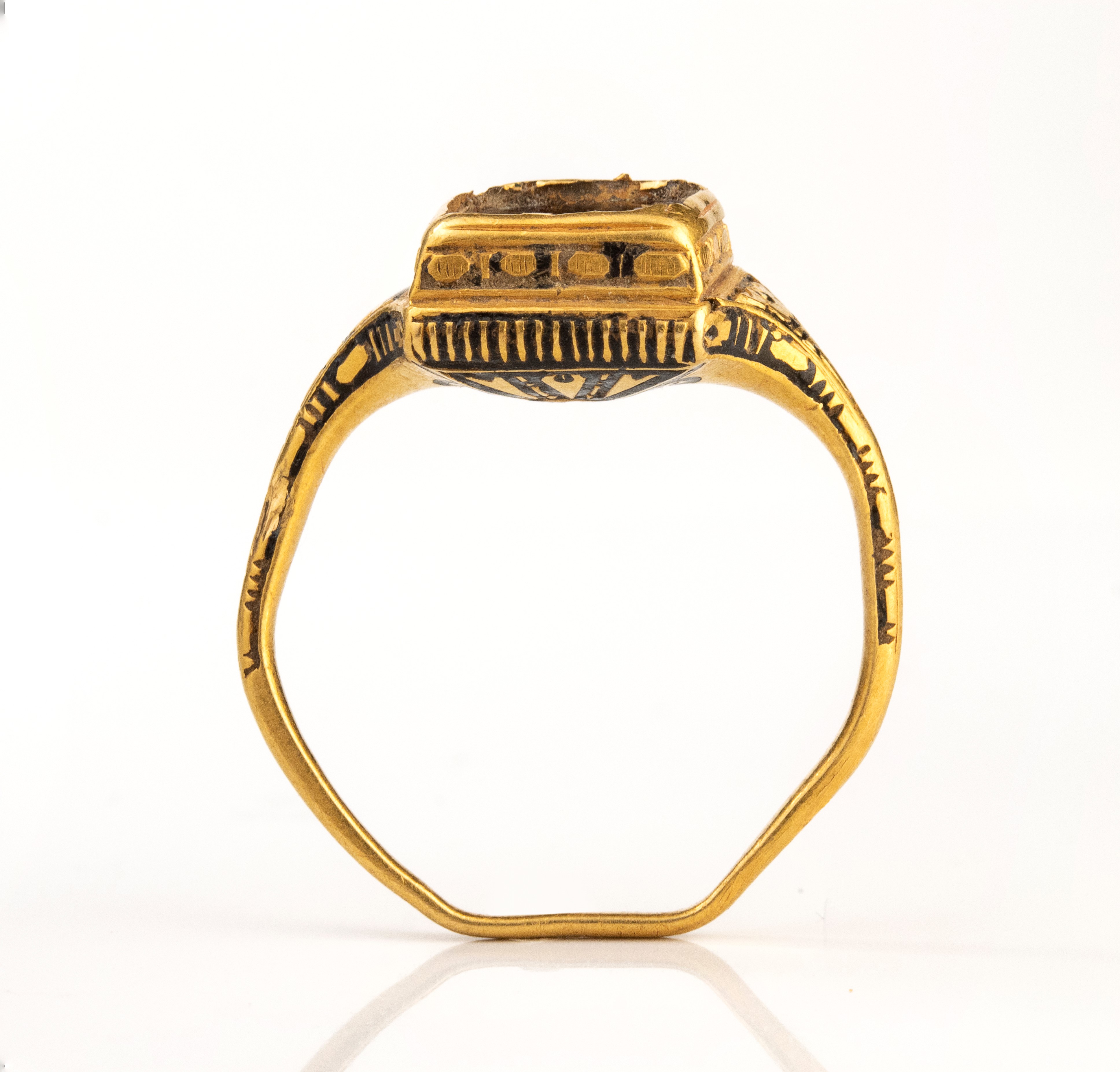 A Late Renaissanace gold and black enamel ring set with a garnet.