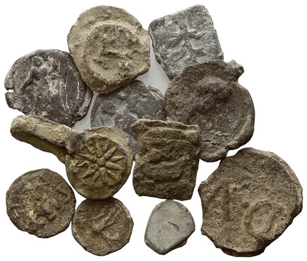 Lot of 11 lead tesserae. Lot to be sold as is, no returns.