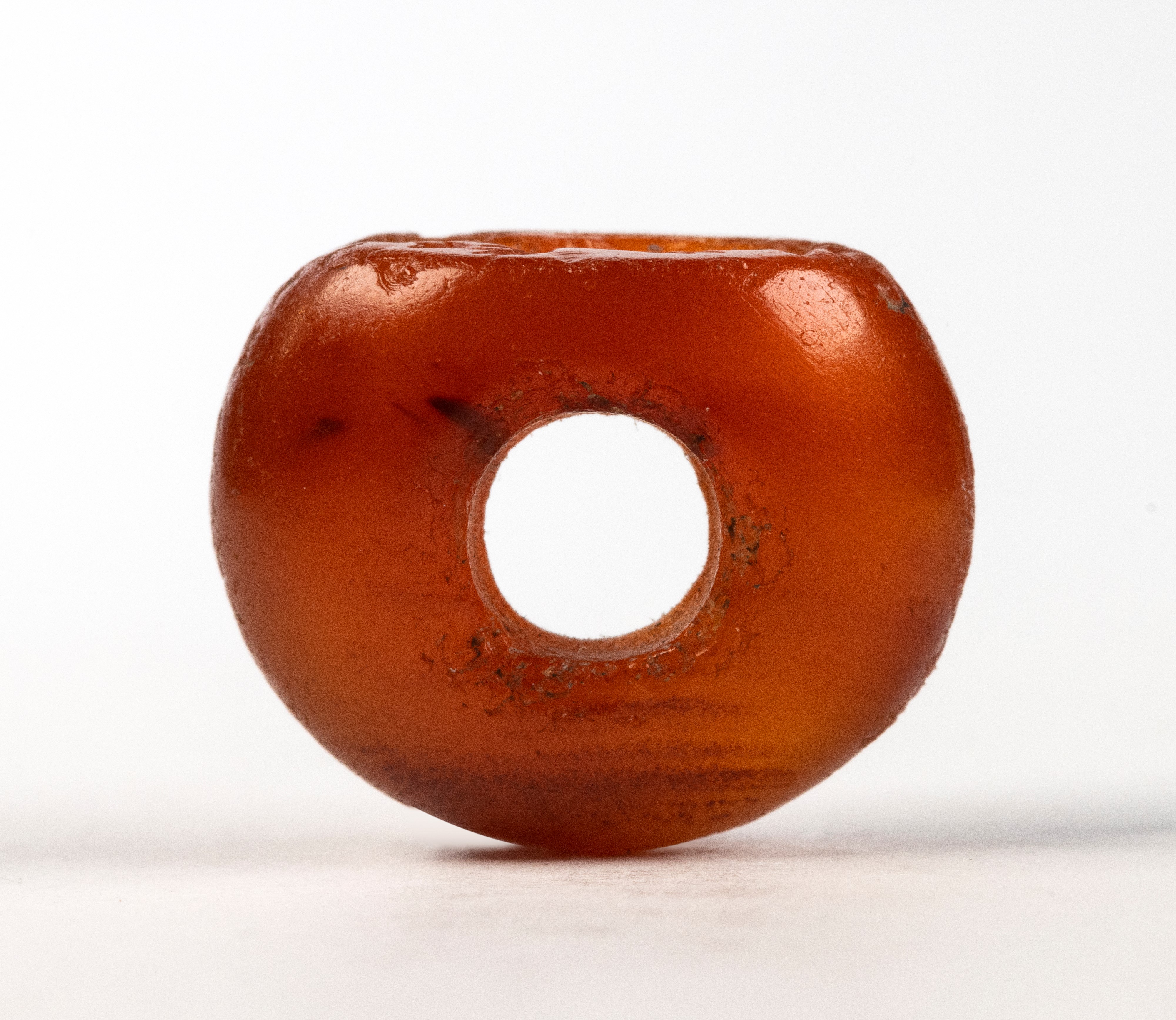 A Sasanian carnelian stamp seal. Woman with a flower.