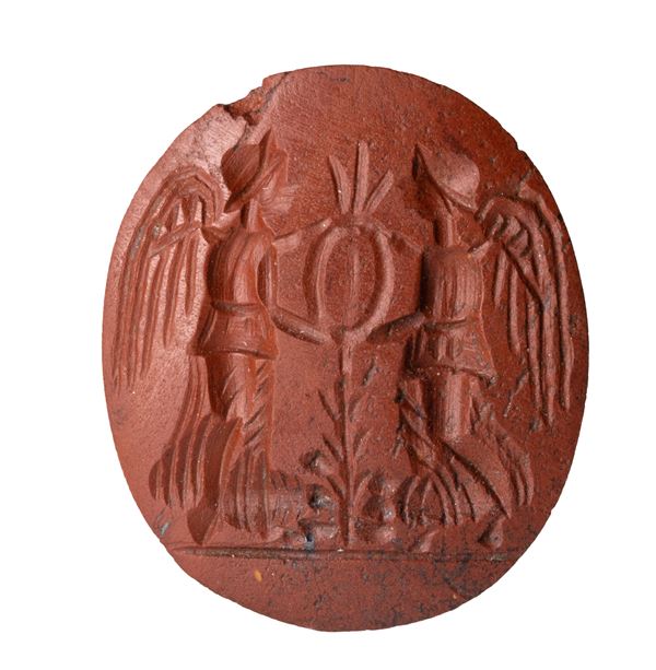 A large Late Roman red jasper intaglio. Emblematic scene with two victories.