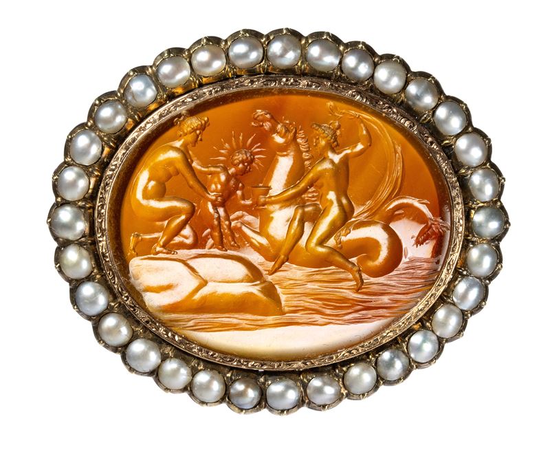 A fine Neoclassical carnelian intaglio set in a gold chiseled brooch with pearls. Mythological sc...