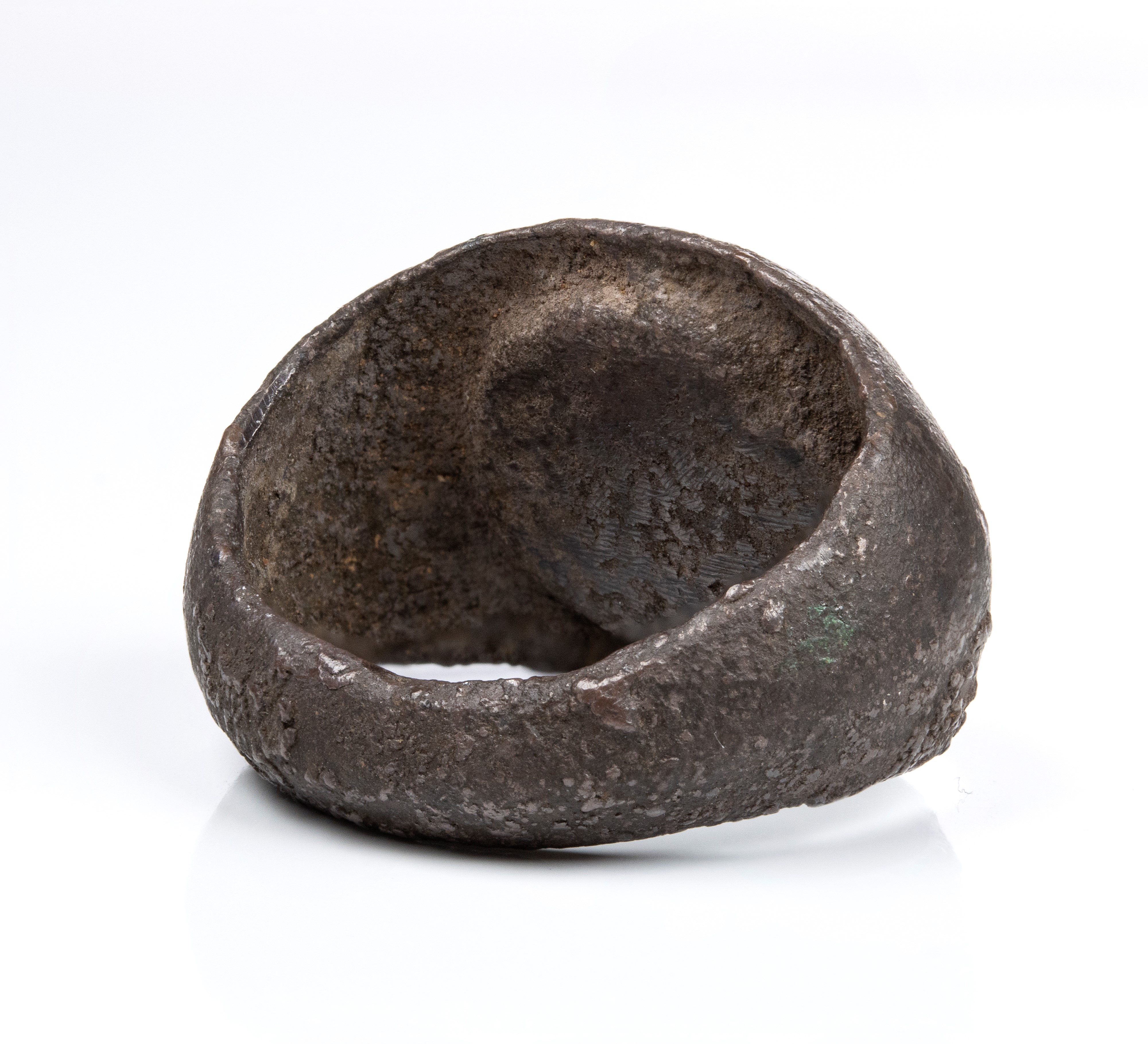 A Roman carnelian intaglio set in a silver ring. Three pigs.