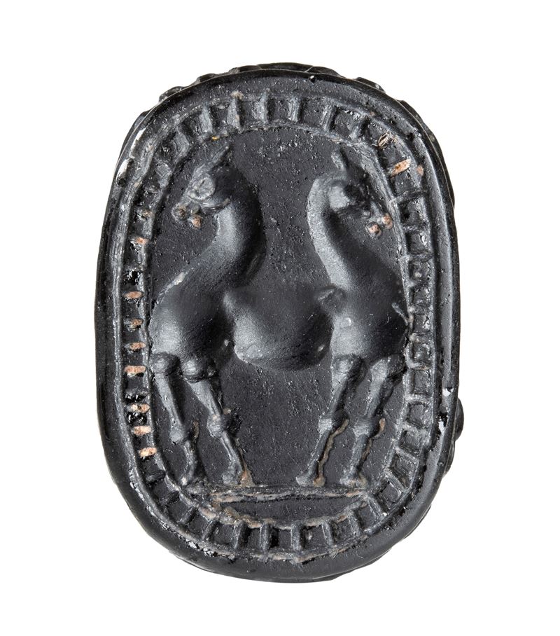 A large black jasper Phoenician engraved scarab.