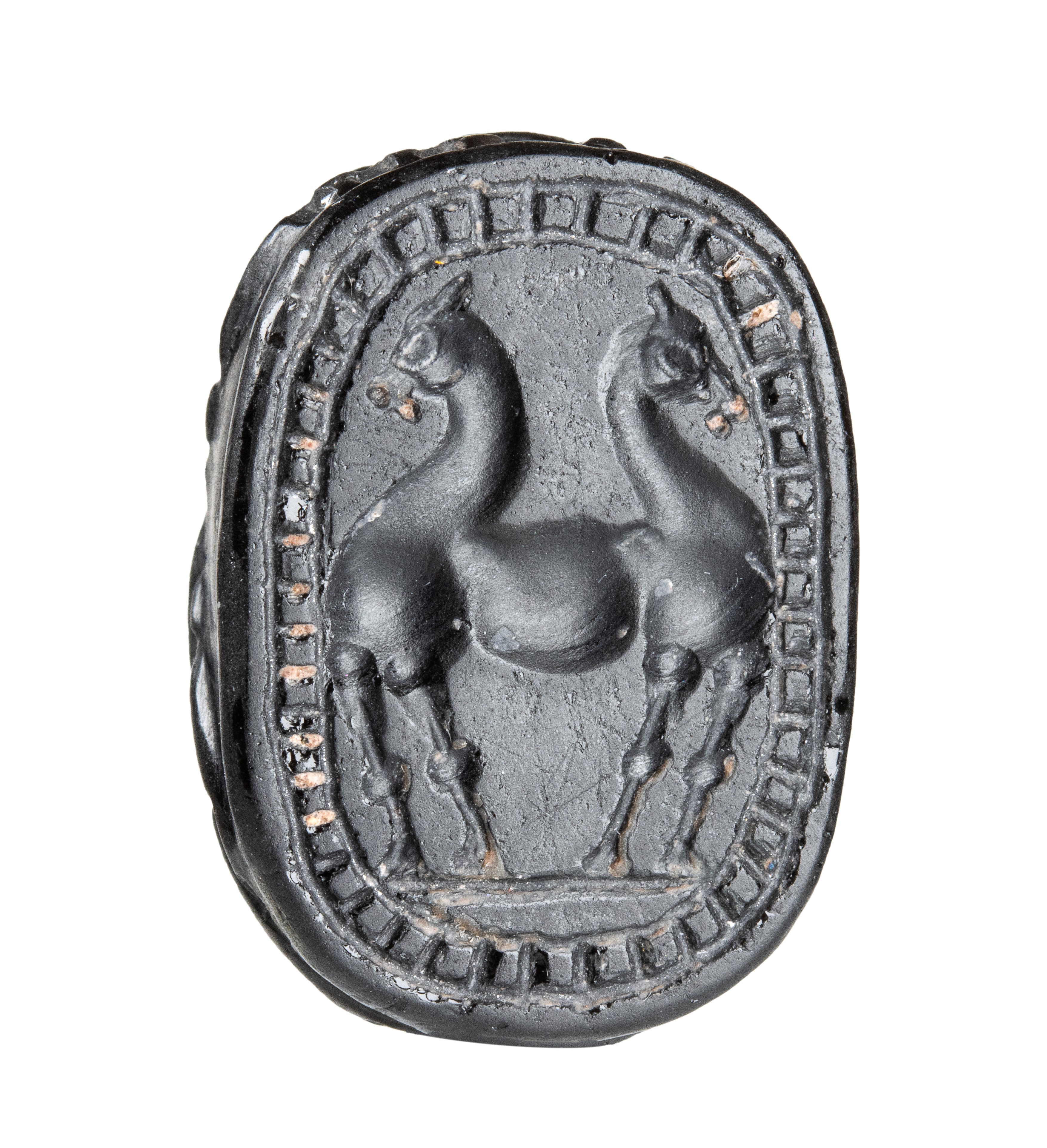 A large black jasper Phoenician engraved scarab.