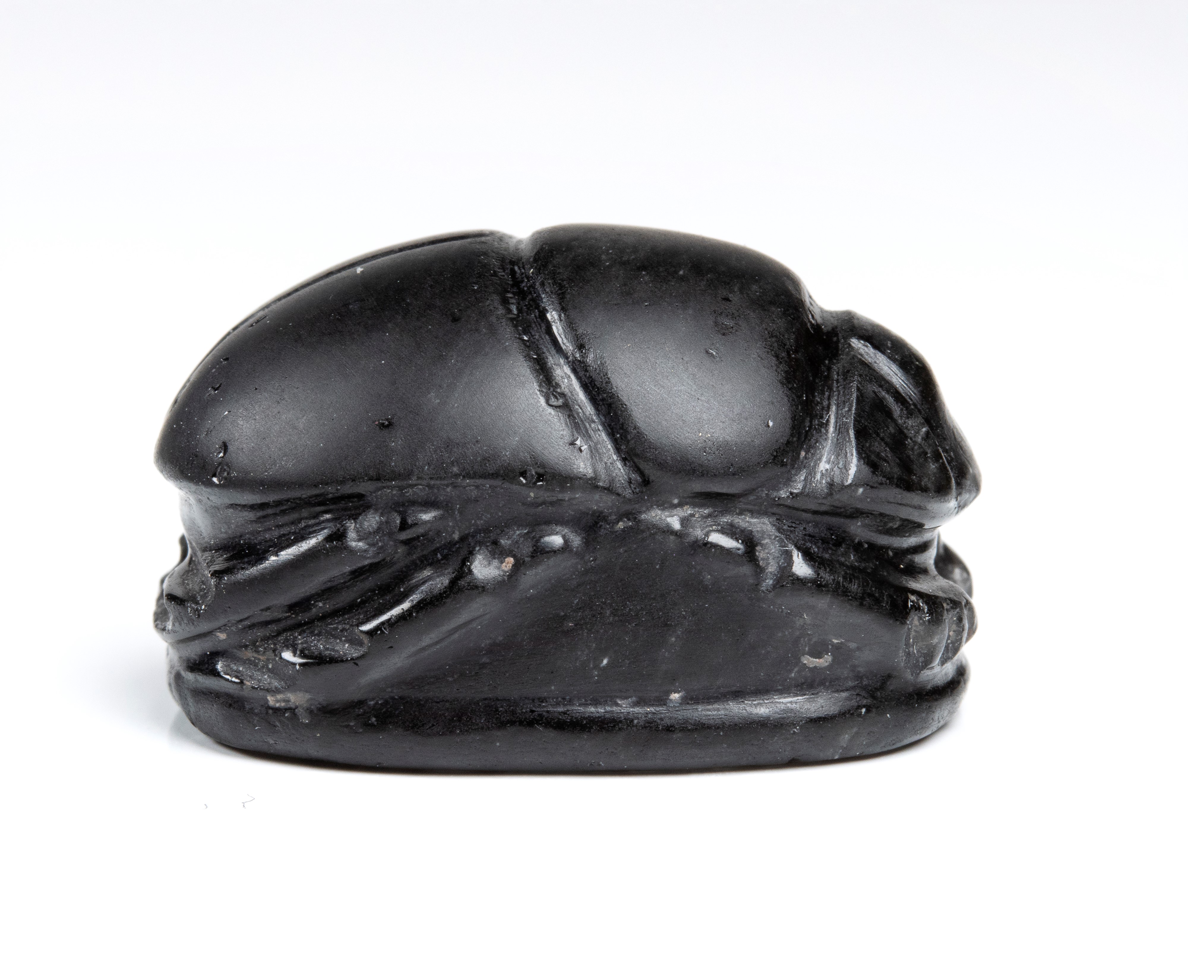 A large black jasper Phoenician engraved scarab.