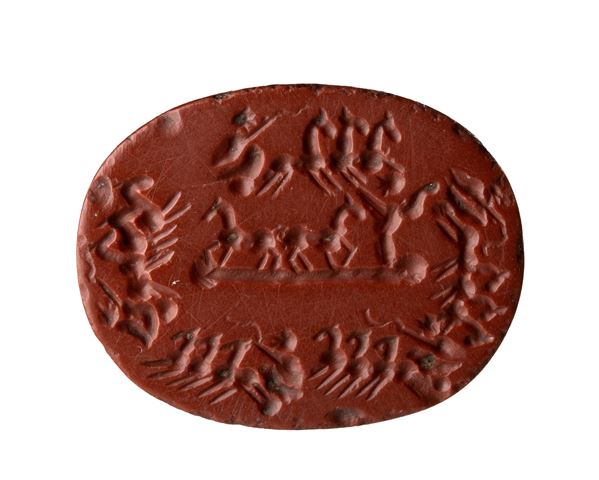 A large Roman provoncial  red jasper intaglio. Circus horse riding scene.