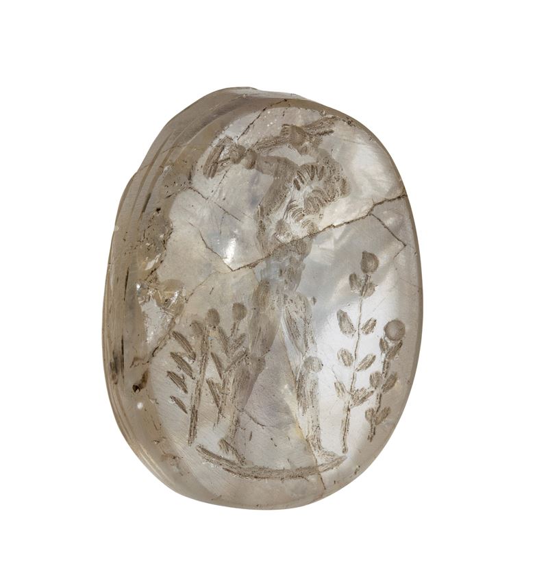 An Egyptian Late Period rock crystal scaraboid engraved in a later period. Rural scene