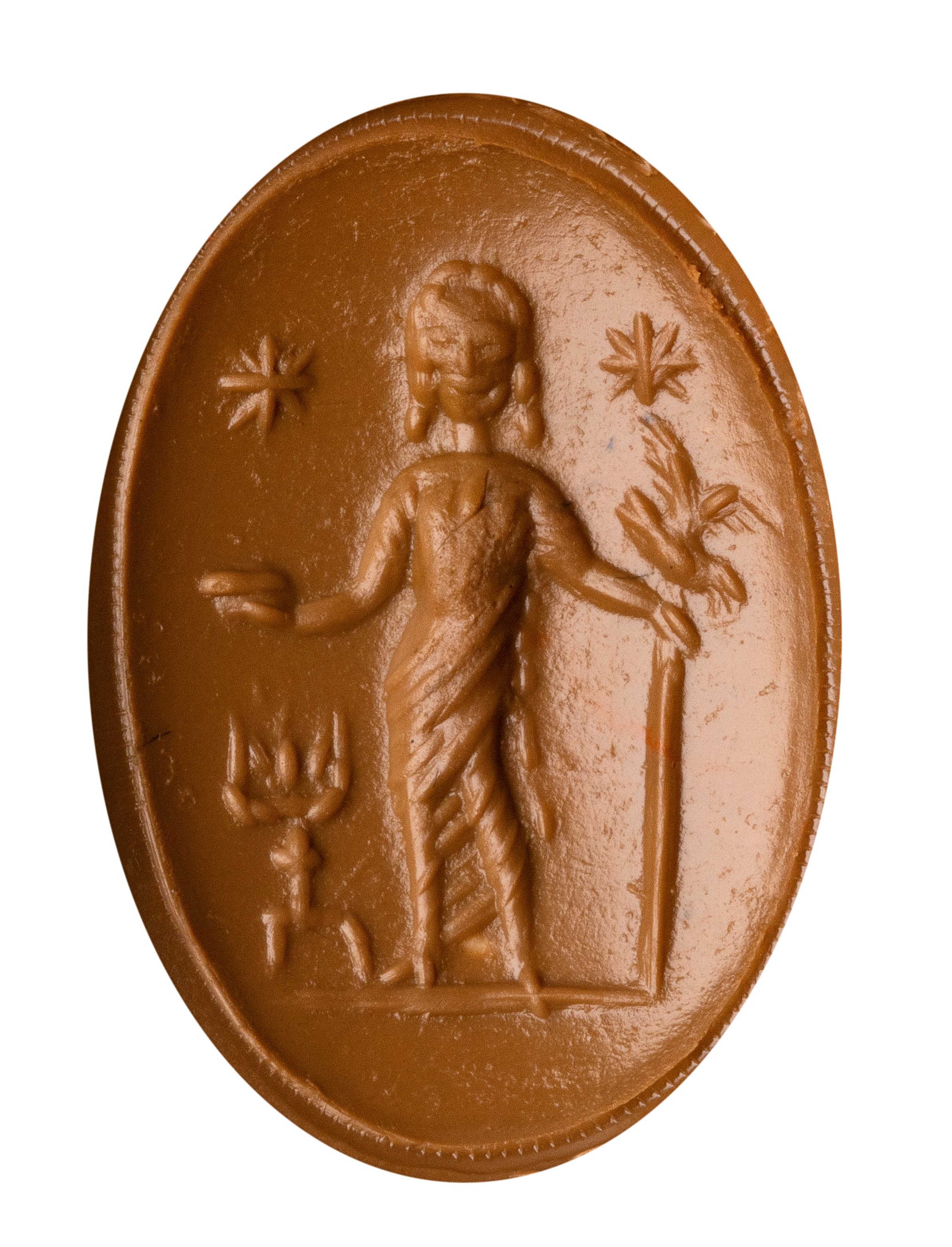 A Roman carnelian intaglio set in a later gold ring. Votive scene.