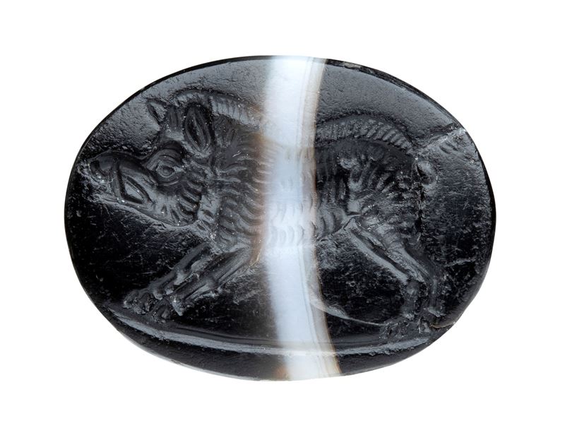 A Roman late republican banded agate intaglio. Boar.