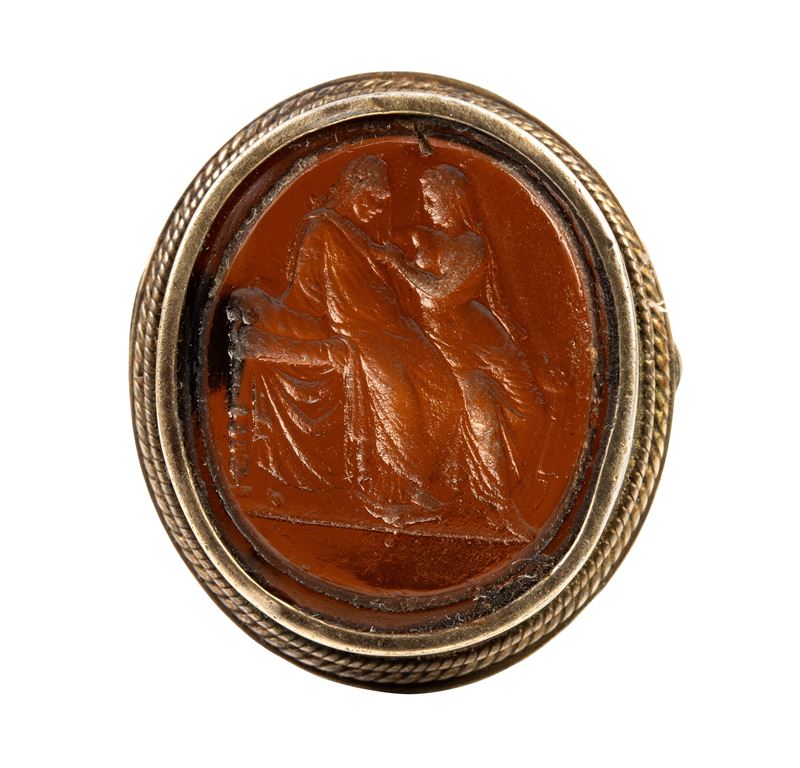 A Grand tour glass cast impression set in a gilted siver brooch. Two figures