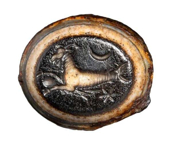 A Roman agate intaglio. Seagoat with astrological attributes.