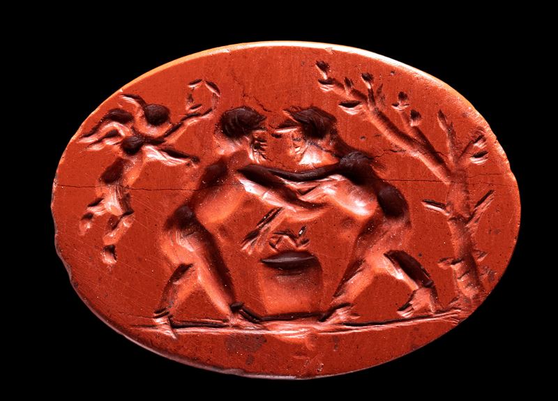 A Roman red jasper intaglio. Fight scene.