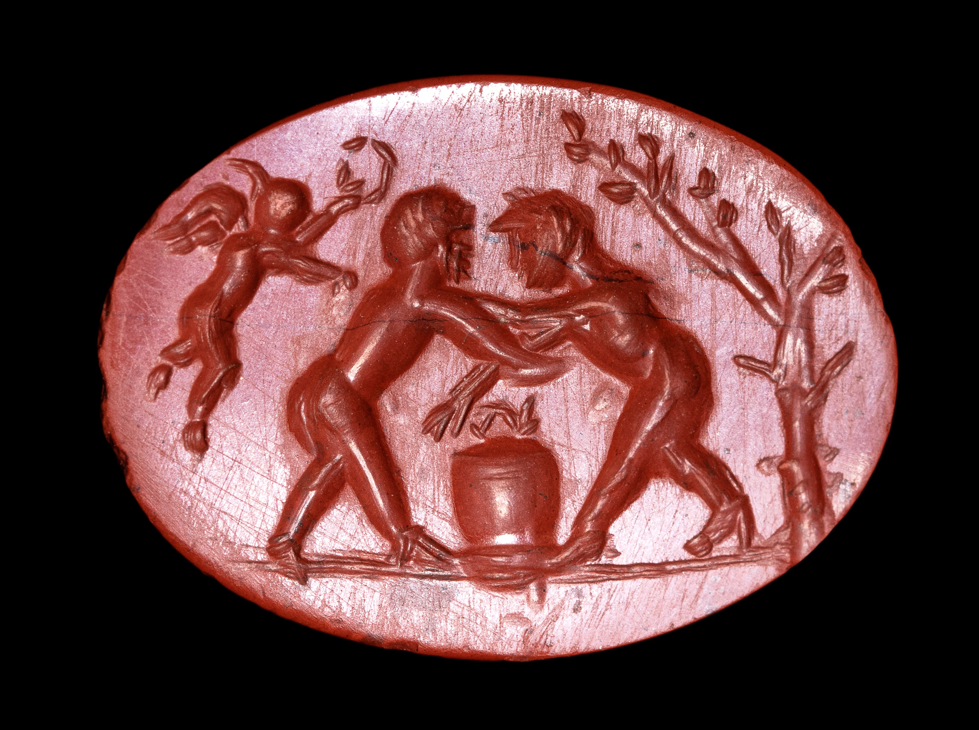 A Roman red jasper intaglio. Fight scene.