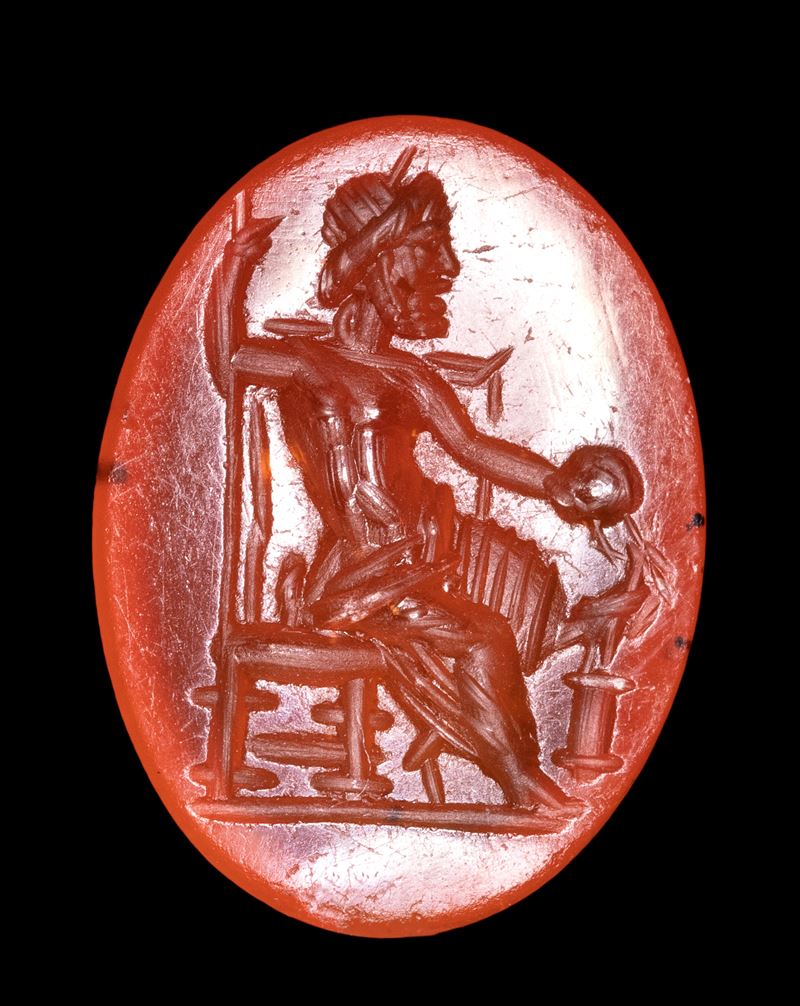 A Roman carnelian intaglio. Seated Zeus.