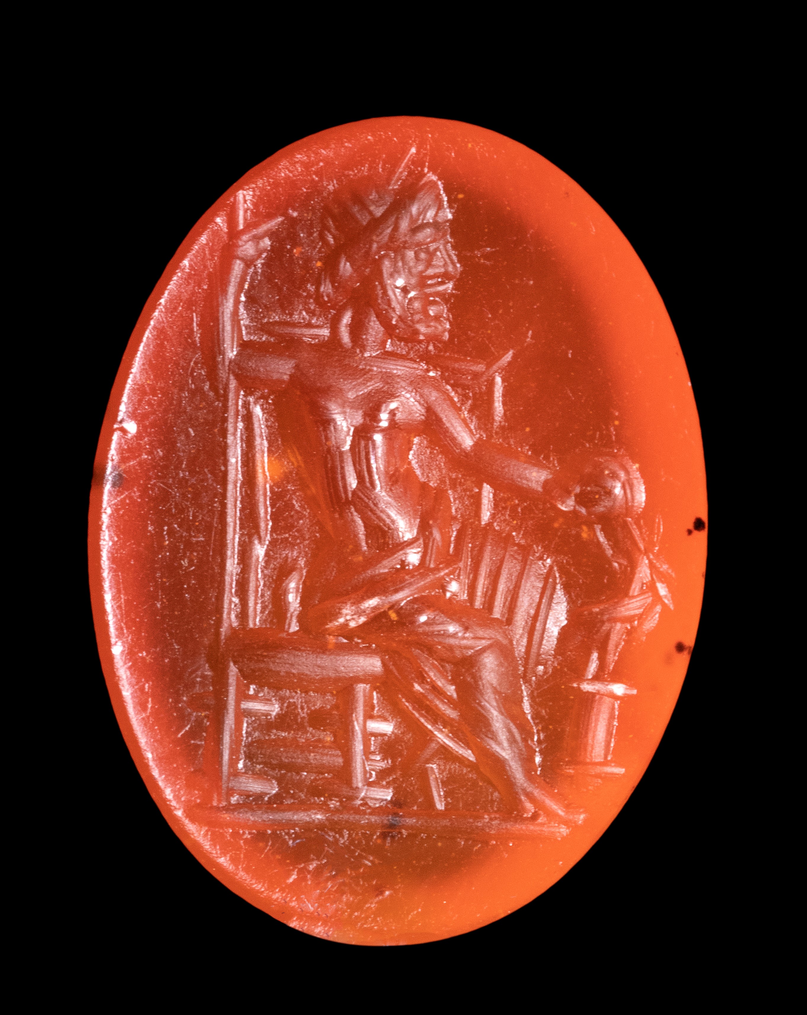 A Roman carnelian intaglio. Seated Zeus.