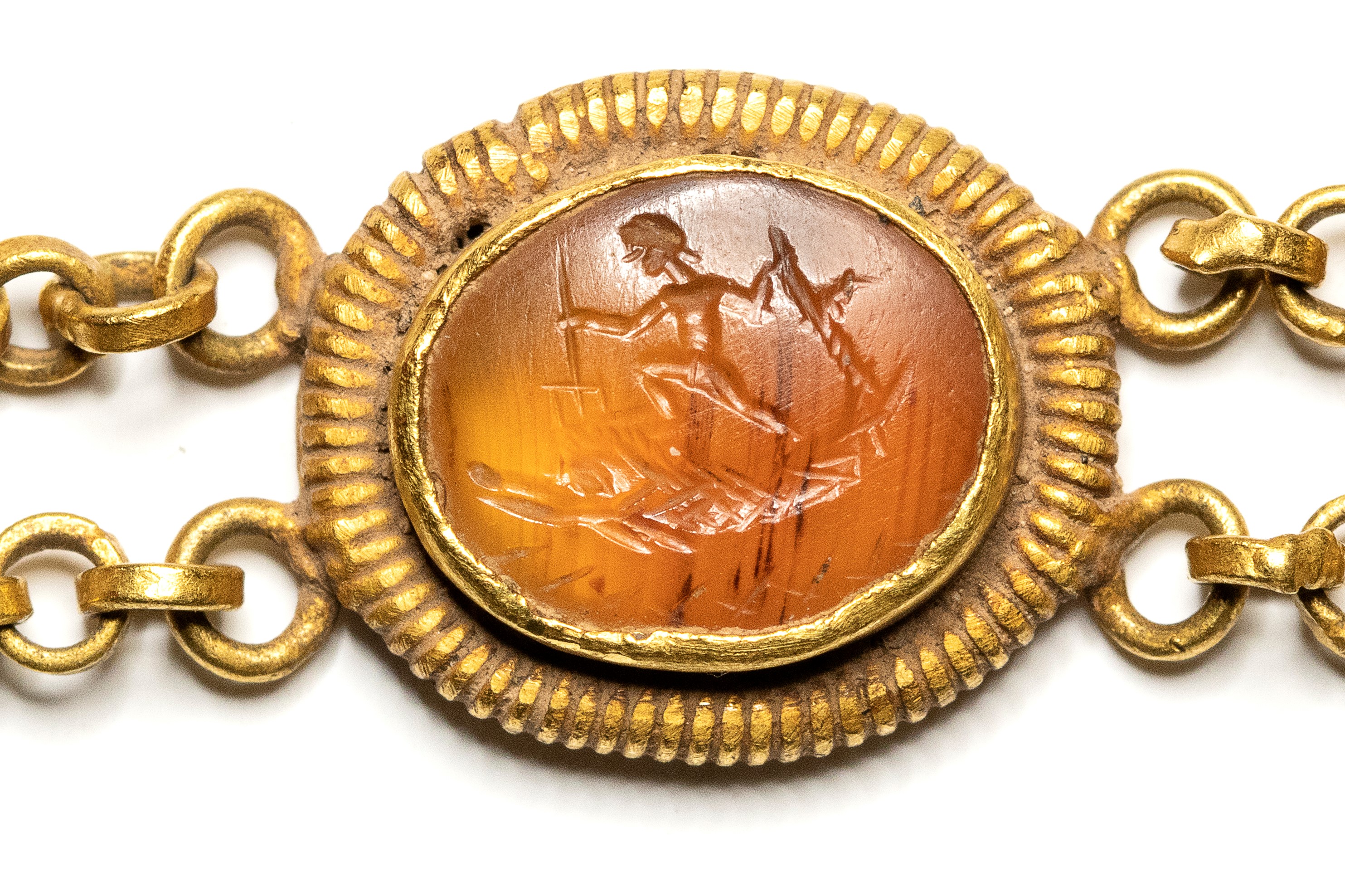 A Roman gold bracelet with six hardstones intaglios. Various subjects.
