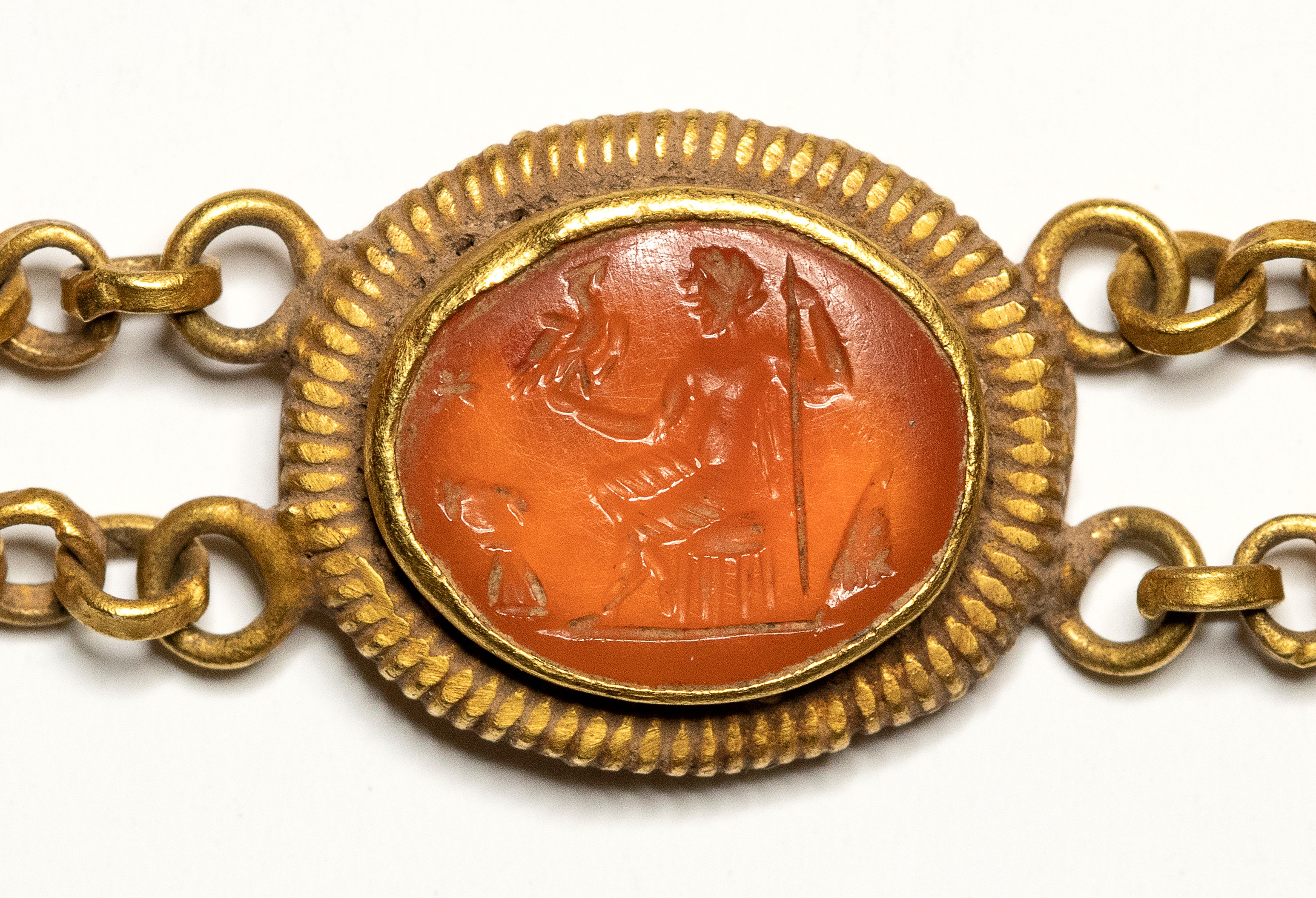 A Roman gold bracelet with six hardstones intaglios. Various subjects.