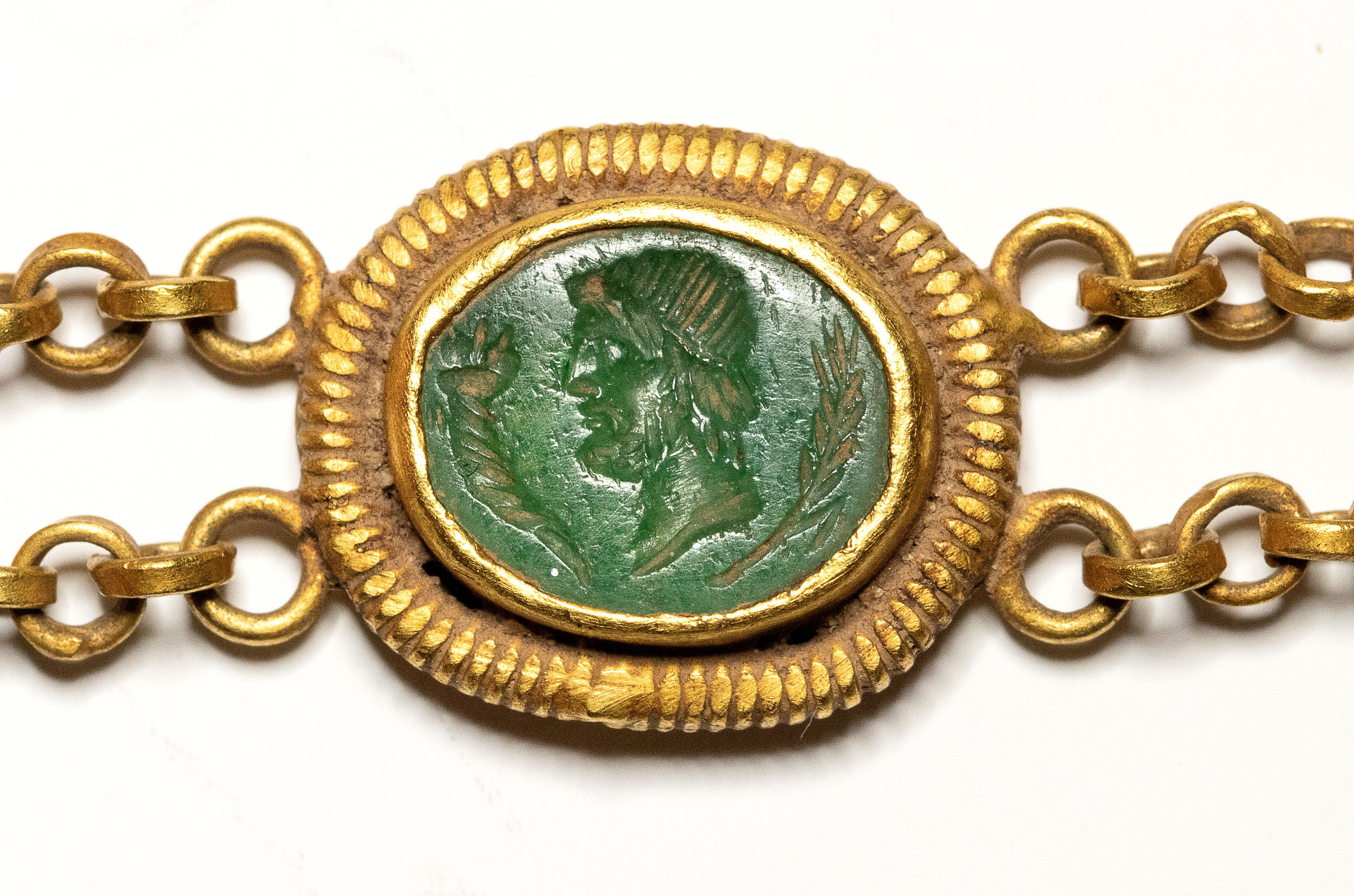 A Roman gold bracelet with six hardstones intaglios. Various subjects.