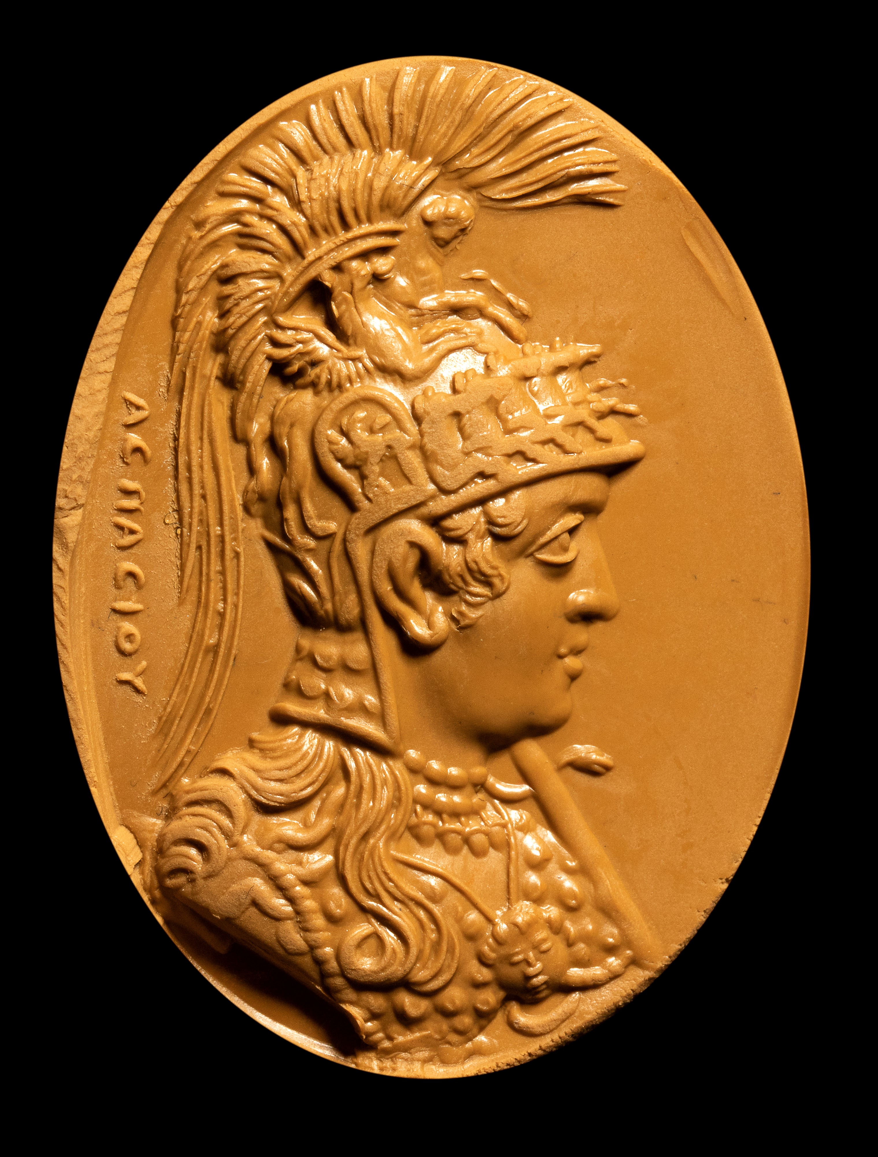 A large carnelian intaglio signed Aspasios. Bust of Athena Parthenos.