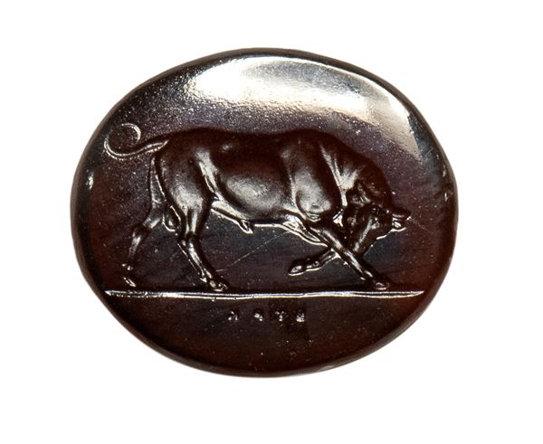 A brownish glass impression. Bull.