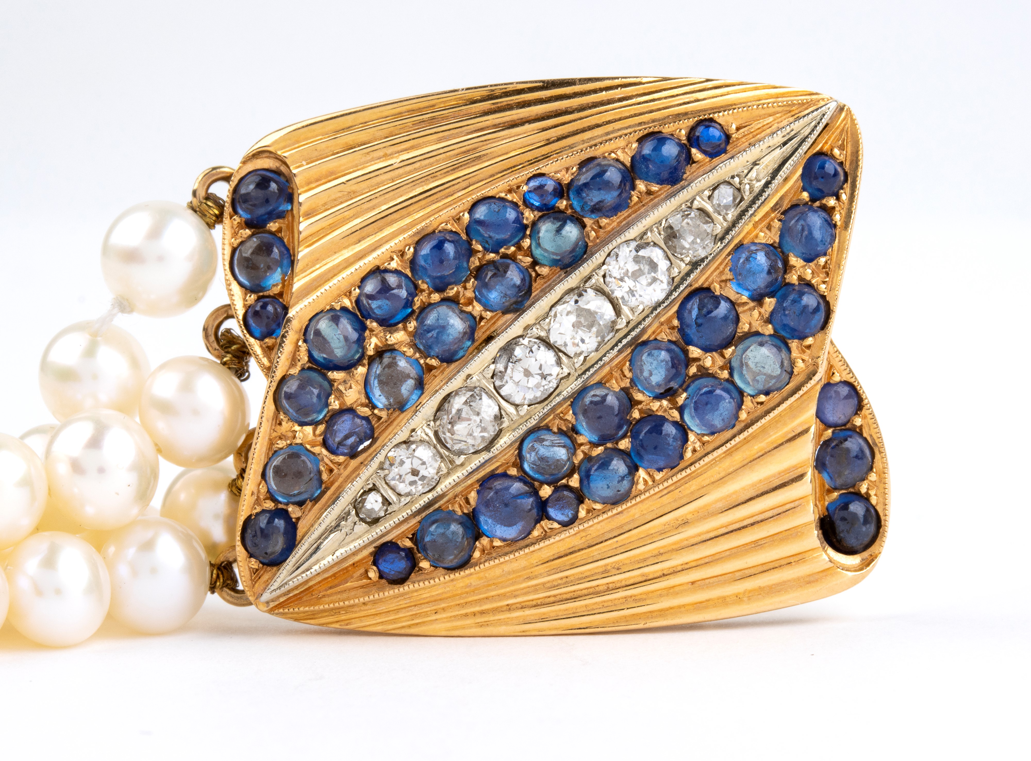 Bracciale in oro con perle, zaffiri e diamanti