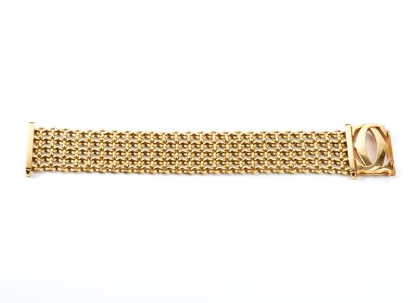 CARTIER - Penelope Collection: vintage 'Double C' gold bracelet, with original box and guarantee